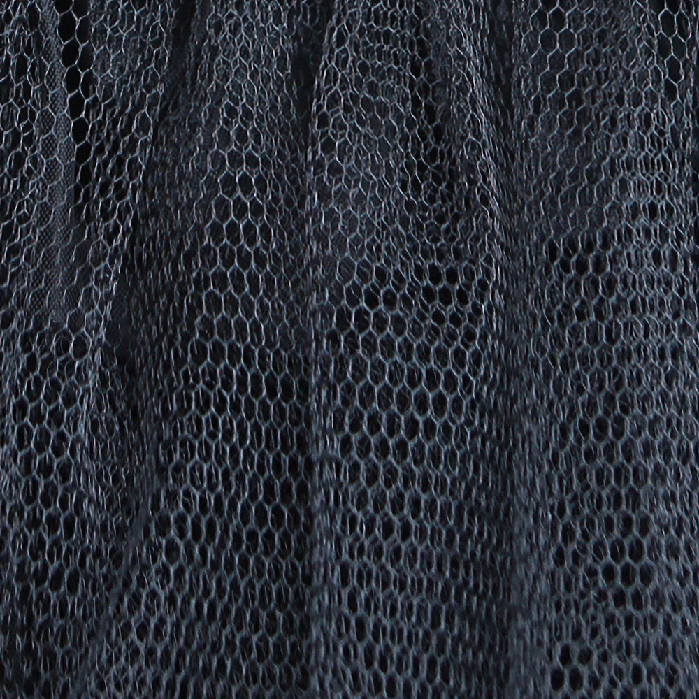 Close-up of black tulle fabric showcasing layered texture, perfect for punk and Lolita fashion looks.