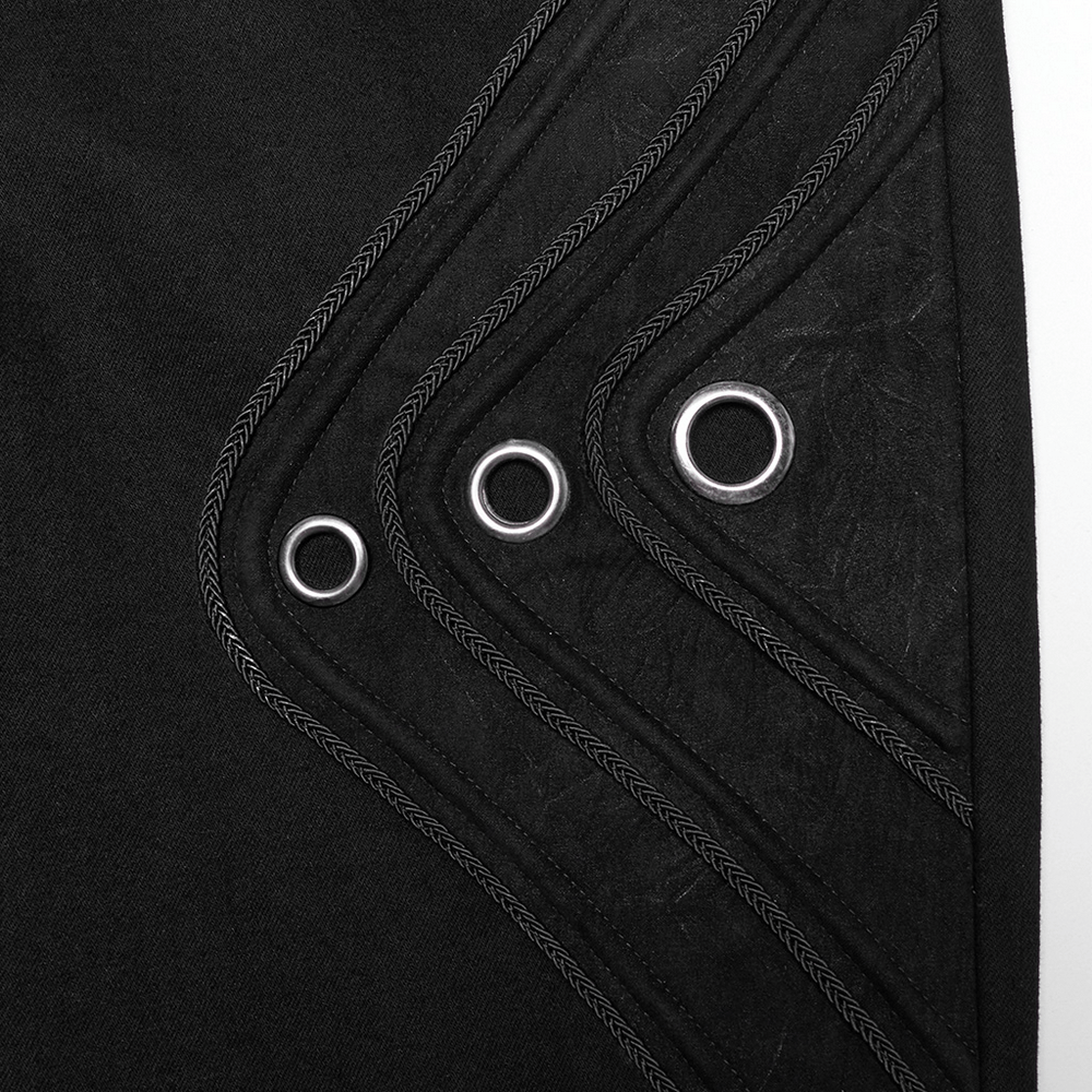 Black twill denim fabric showcasing eyelet details and 3D patchwork design for a punk-inspired look.