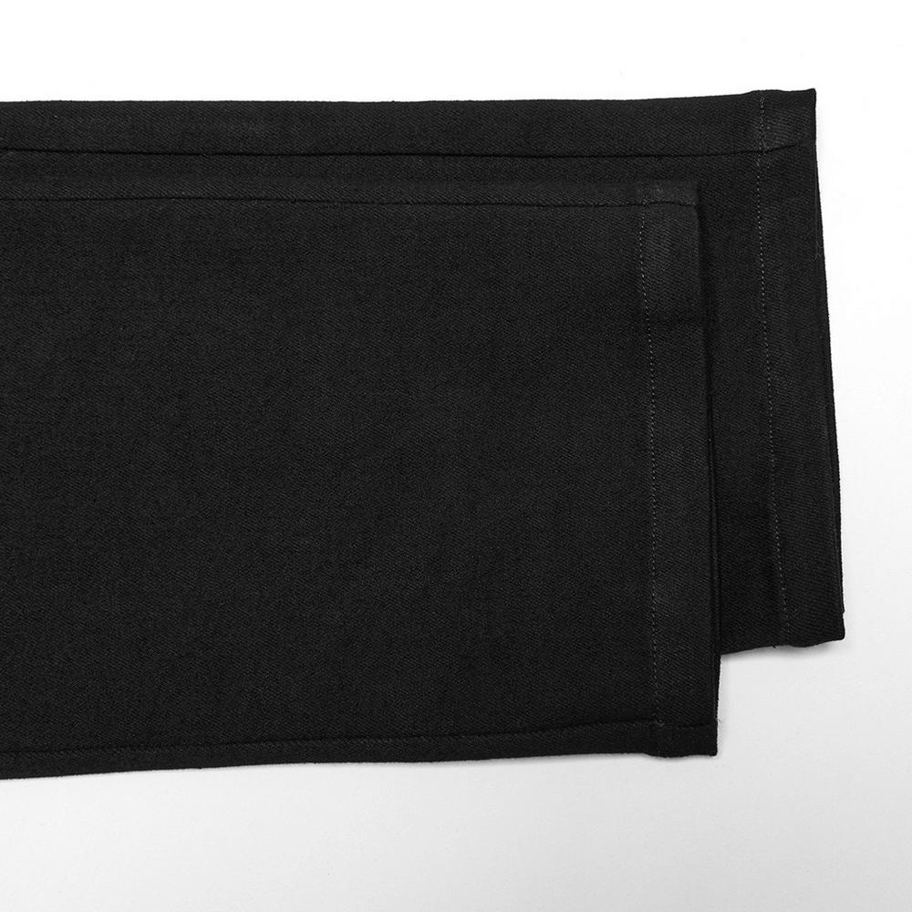 Close-up of black twill denim pants showcasing eyelet details and pockets, perfect for a punk-inspired style.