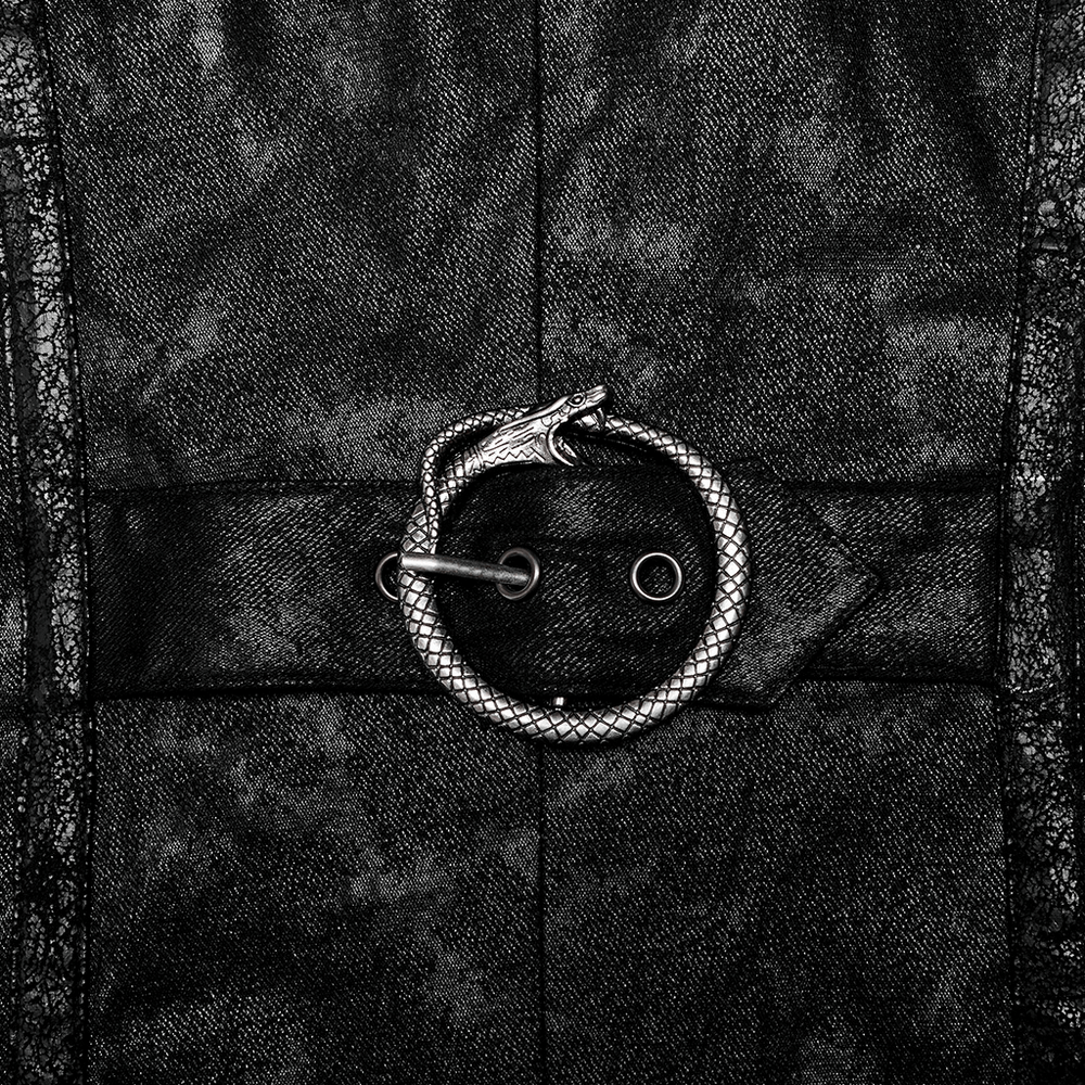 Close-up of snake-shaped metal detail on black fabric, showcasing edgy design of punk coat.