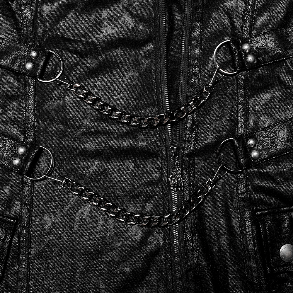 Close-up of black twill coat with chains, showcasing edgy punk style and gothic details.