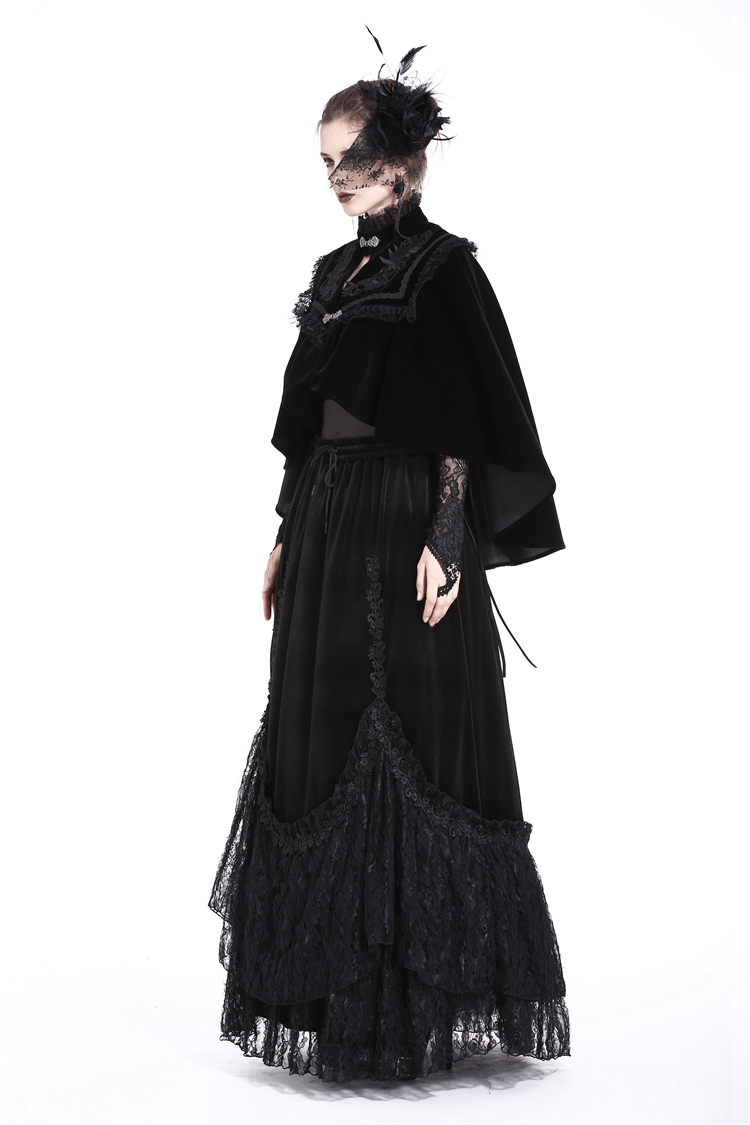Gothic black velvet capelet with embroidered lace collar, styled elegantly for a dramatic, Victorian-inspired look.