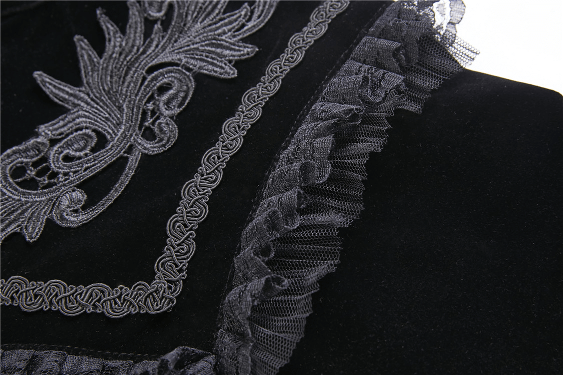 Close-up of black velvet cape with intricate embroidered lace collar and delicate ruffled trim, perfect for gothic elegance.