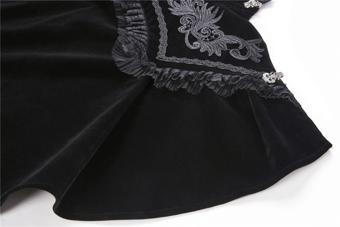 Elegant black velvet cape with intricate embroidered lace collar and decorative fringes, perfect for a gothic Victorian look.