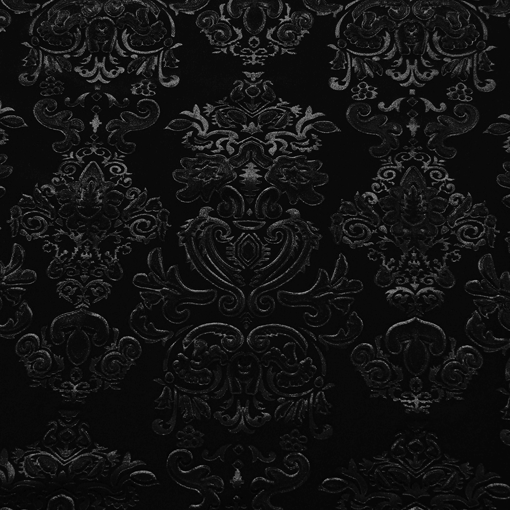 Intricate embossed floral pattern on luxurious black velvet fabric, perfect for gothic fashion.
