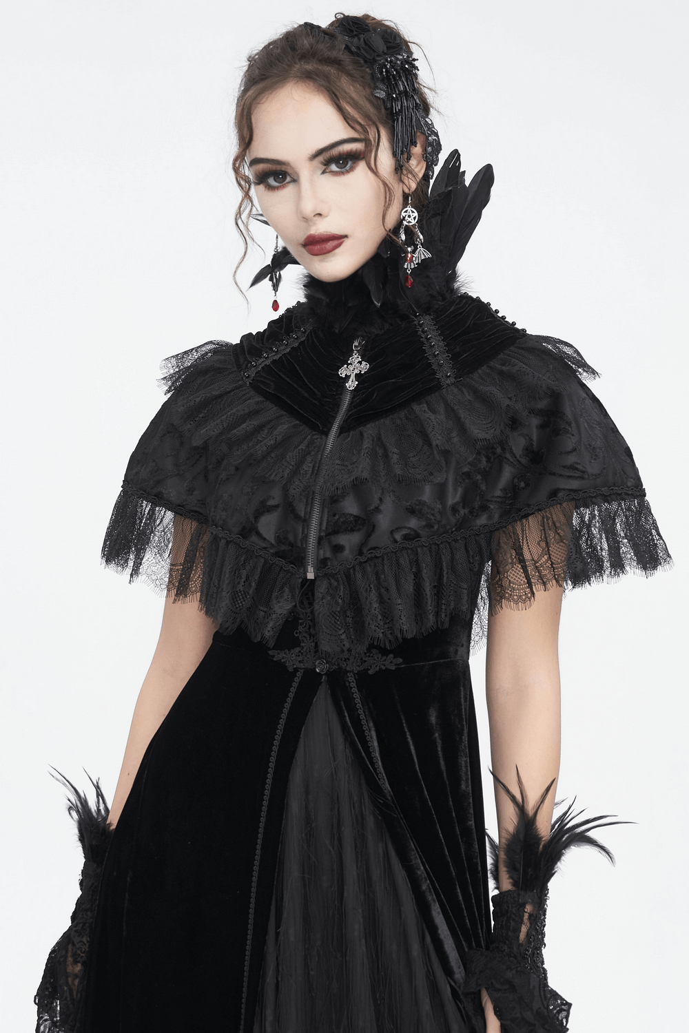 Elegant black velvet gothic cape featuring lace trim and feathers, perfect for costumes and dramatic outfits.