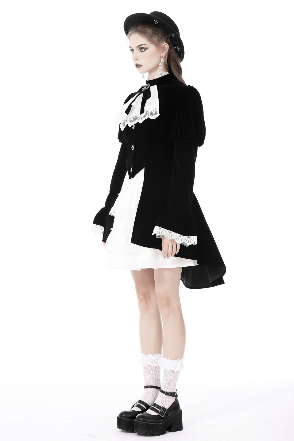 Elegant model wearing a black velvet gothic coat with white lace collar and cuffs, paired with a cute white dress.