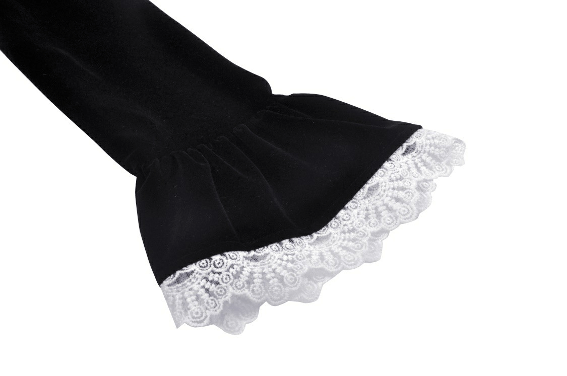 Close-up of the lace cuffs on a black velvet gothic coat, showcasing elegant white lace detailing.