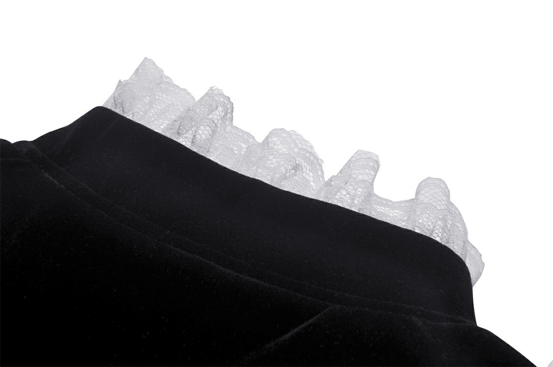 Close-up of the black velvet coat showcasing the intricate white lace collar detailing.