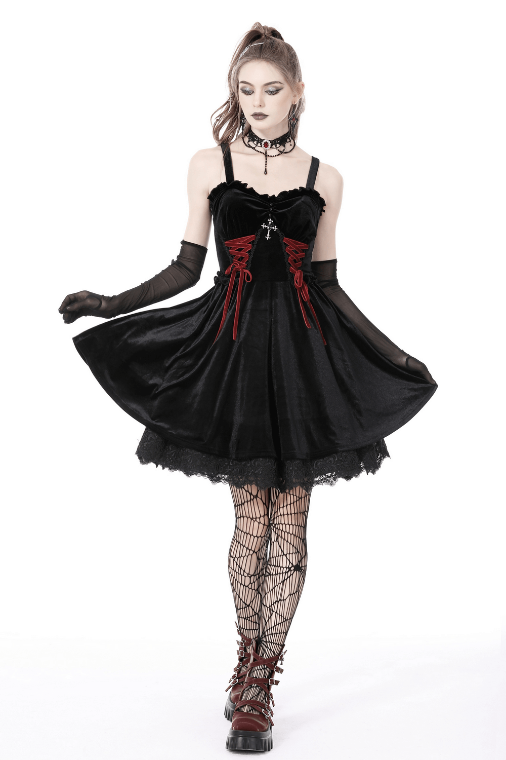 Gothic black velvet mini dress with red lace-up detail and cross, perfect for dark romance and Halloween.