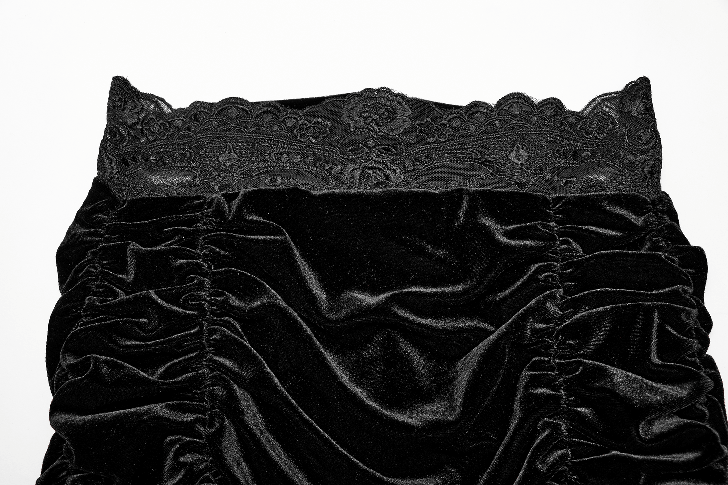 Black velvet mini skirt with gothic lace waist and ruffled details, perfect for an enchanting, dark queen look.