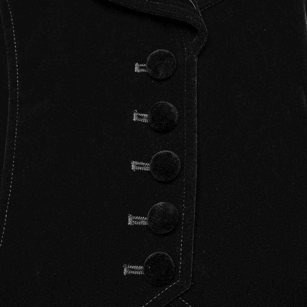 Close-up of black velvet gothic tailcoat buttons with intricate embroidery detailing.