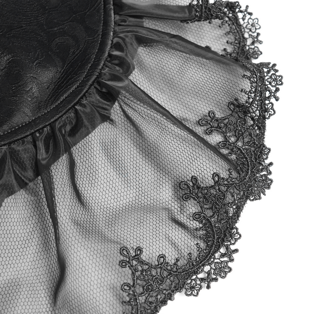 Black velvet fabric with sheer lace trim, featuring intricate floral patterns and frill details, perfect for gothic fashion.