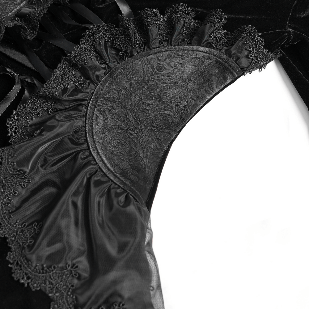 Close-up of elegant Victorian lace trim on black velvet gothic top with intricate detailing.