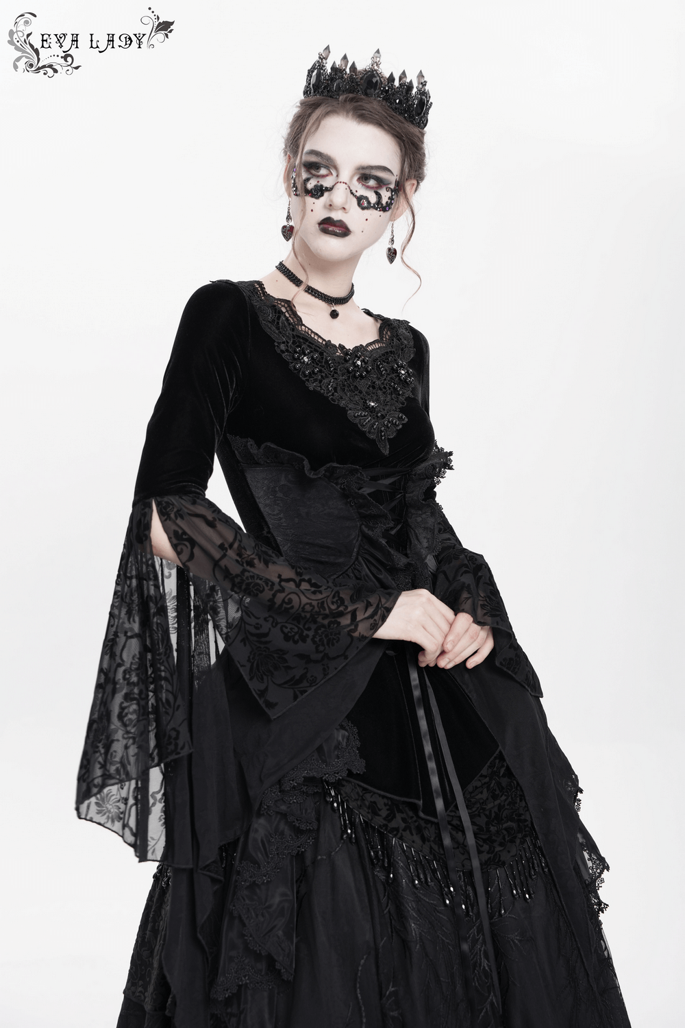 Gothic black velvet top with corset front, lace sleeves, and Victorian lace trim for dramatic style.