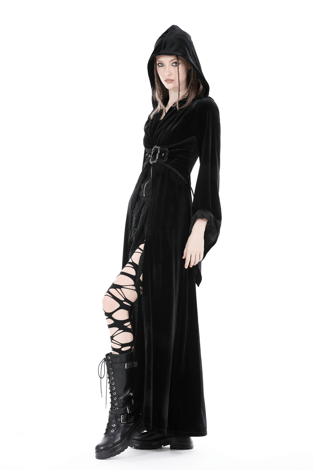 Model in a black velvet hooded cloak with a belt, showcasing a gothic witchy style, perfect for dramatic outfits.