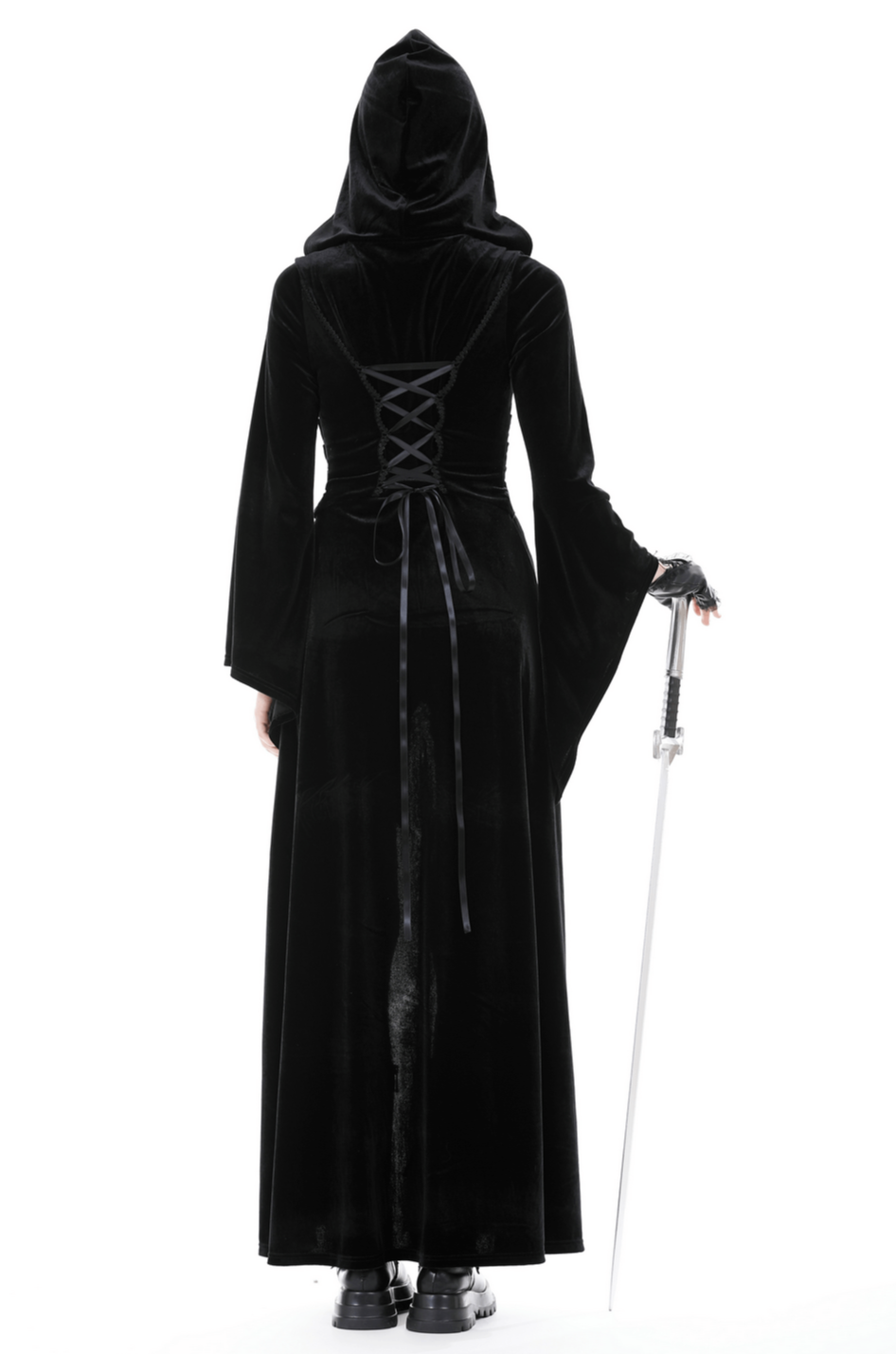 Mysterious figure wearing a black velvet hooded cloak with lace-up back, holding a sword.