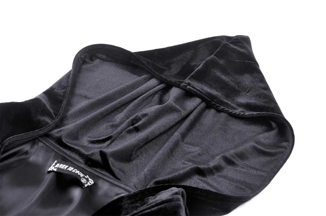 Close-up of the luxurious velvet hood interior of a black hooded cloak, perfect for a gothic witchy look.
