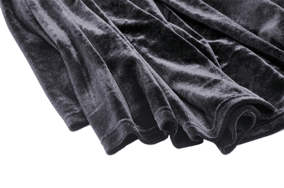 Close-up of luxurious black velvet fabric, showcasing its soft texture and shimmer, perfect for a gothic hooded cloak.