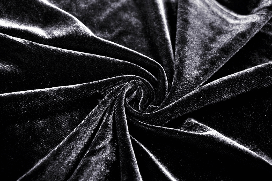 Luxurious black velvet fabric, perfect for creating elegant gothic cloaks or garments with a dramatic touch.