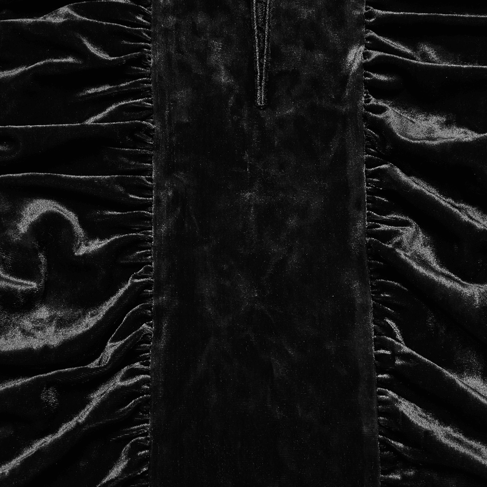 Close-up of black velvet lace cross dress with ruched waist and hood, showcasing luxurious texture and intricate design.