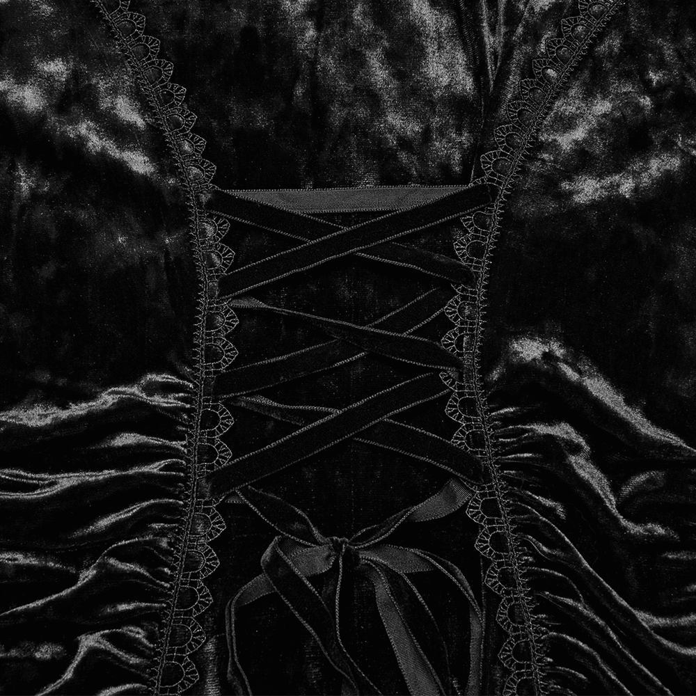 Close-up of black velvet lace cross dress featuring intricate lace details and ruched waist design.