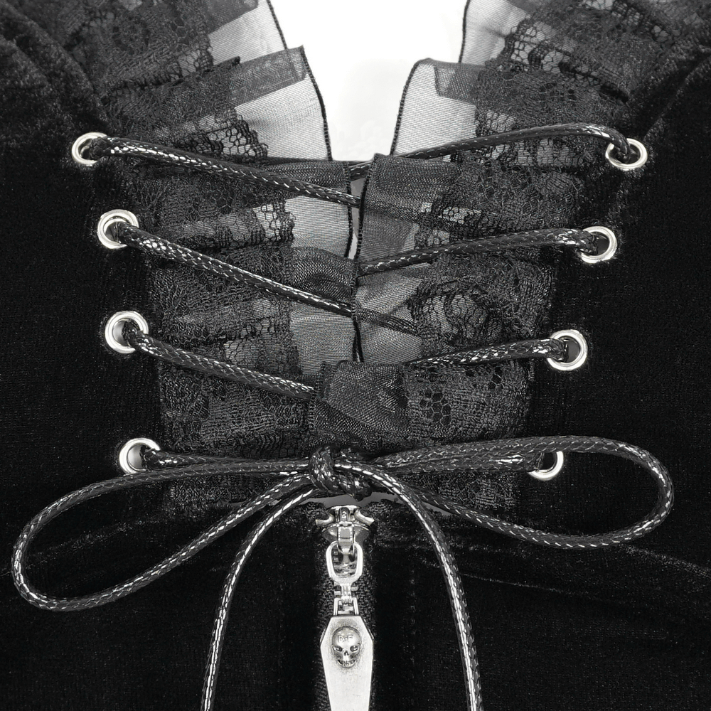 Close-up of black velvet bodysuit's lace trim and lace-up detail, showcasing stylish accents and edgy design.