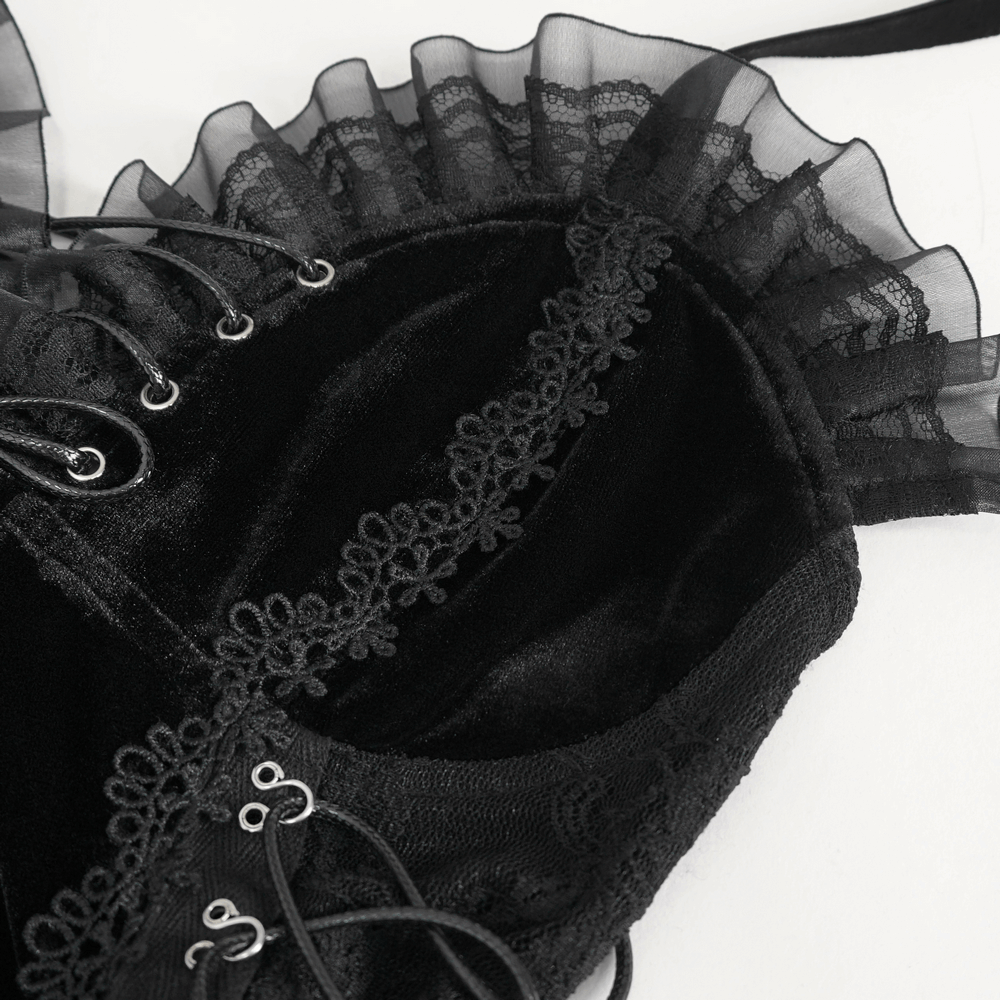 Close-up of black velvet lace trim bodysuit showing delicate lace accents and lace-up design.