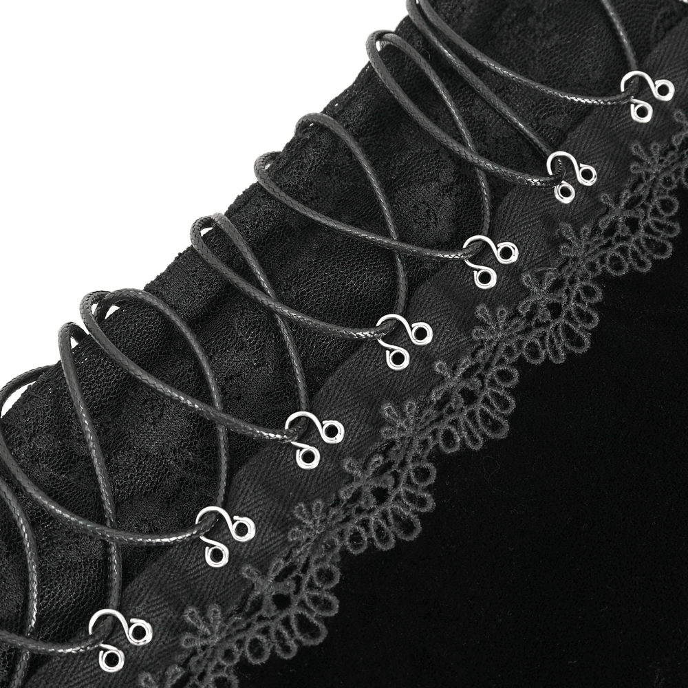 Close-up of black velvet lace trim and lace-up details on a stylish halter bodysuit lingerie.