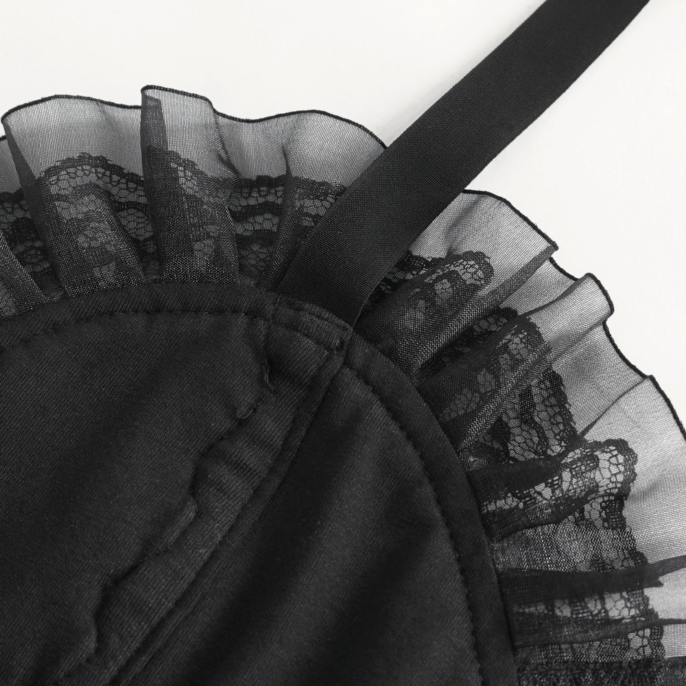 Close-up of the lace trim on a black velvet halter bodysuit, highlighting luxurious fabric and feminine design.