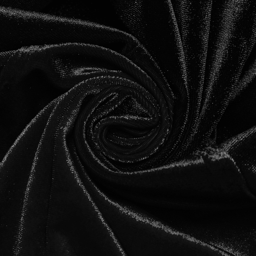 Close-up of soft black velvet fabric, showcasing its rich texture and sheen for gothic-inspired fashion.