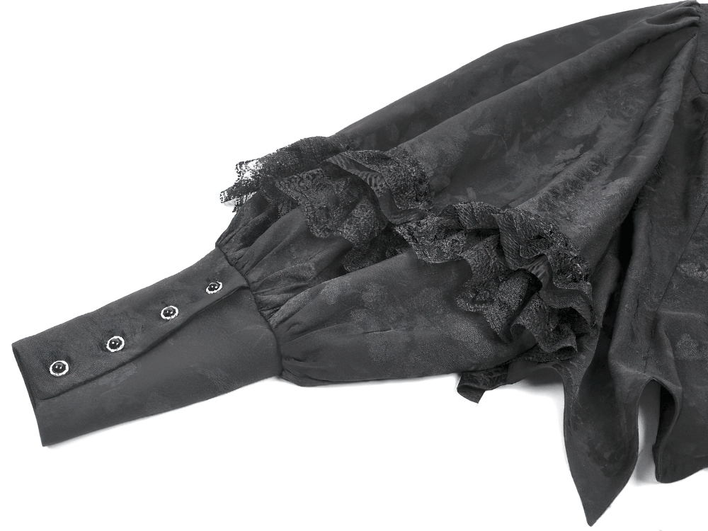 Black Victorian Gothic Blouse with Lace Jabot detail featuring ruffle trim and buttoned cuffs.