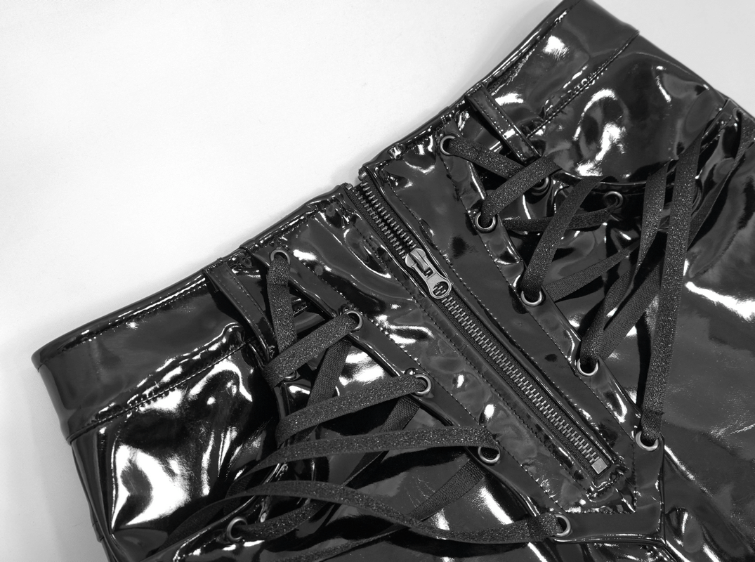Black vinyl mini skirt with pockets and gothic lace-up detail, showcasing shiny PU leather and a central zipper.