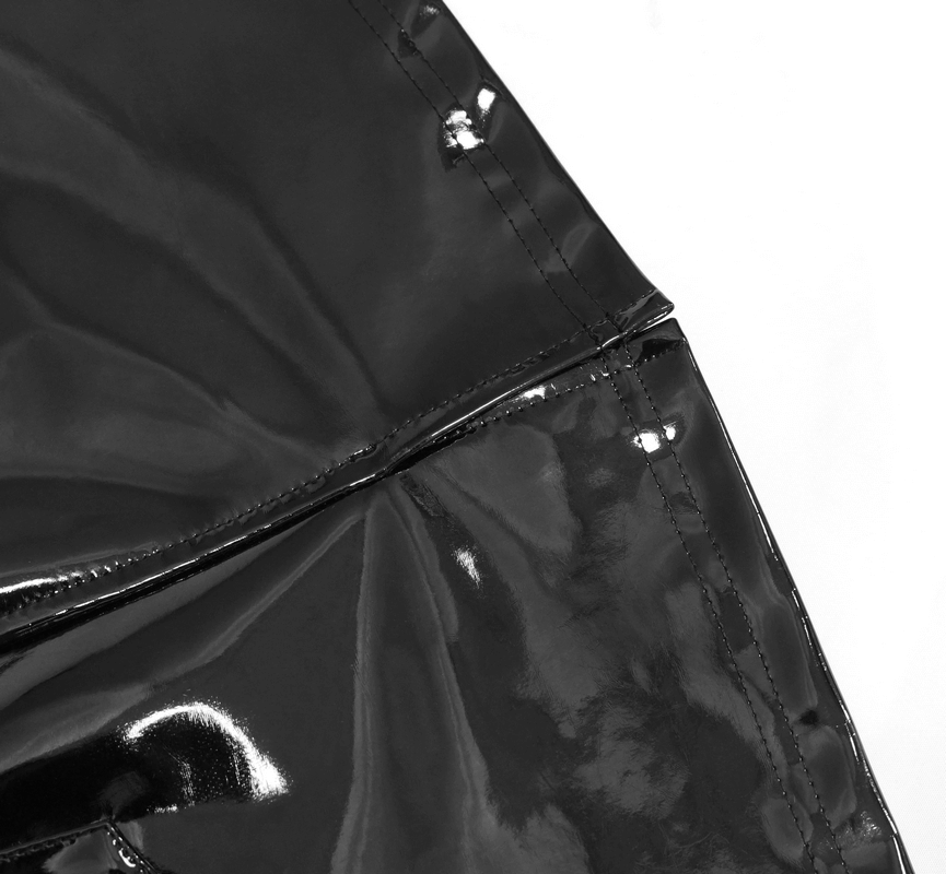 Close-up of a black patent leather mini skirt showcasing zipper detail and glossy texture.
