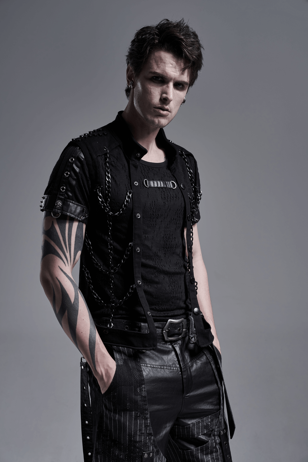 Black Warlock Chain Waistcoat showcasing punk rave style with striking metal chains and edgy fashion details.