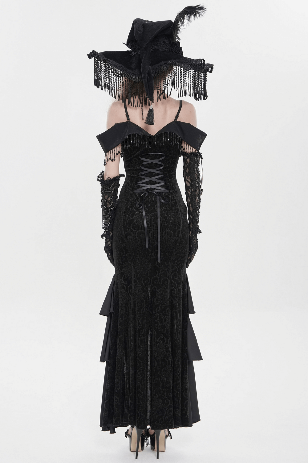 Black Witch Hat with Lace Fringe and Feather Detail worn with an elegant black gothic dress from the back.