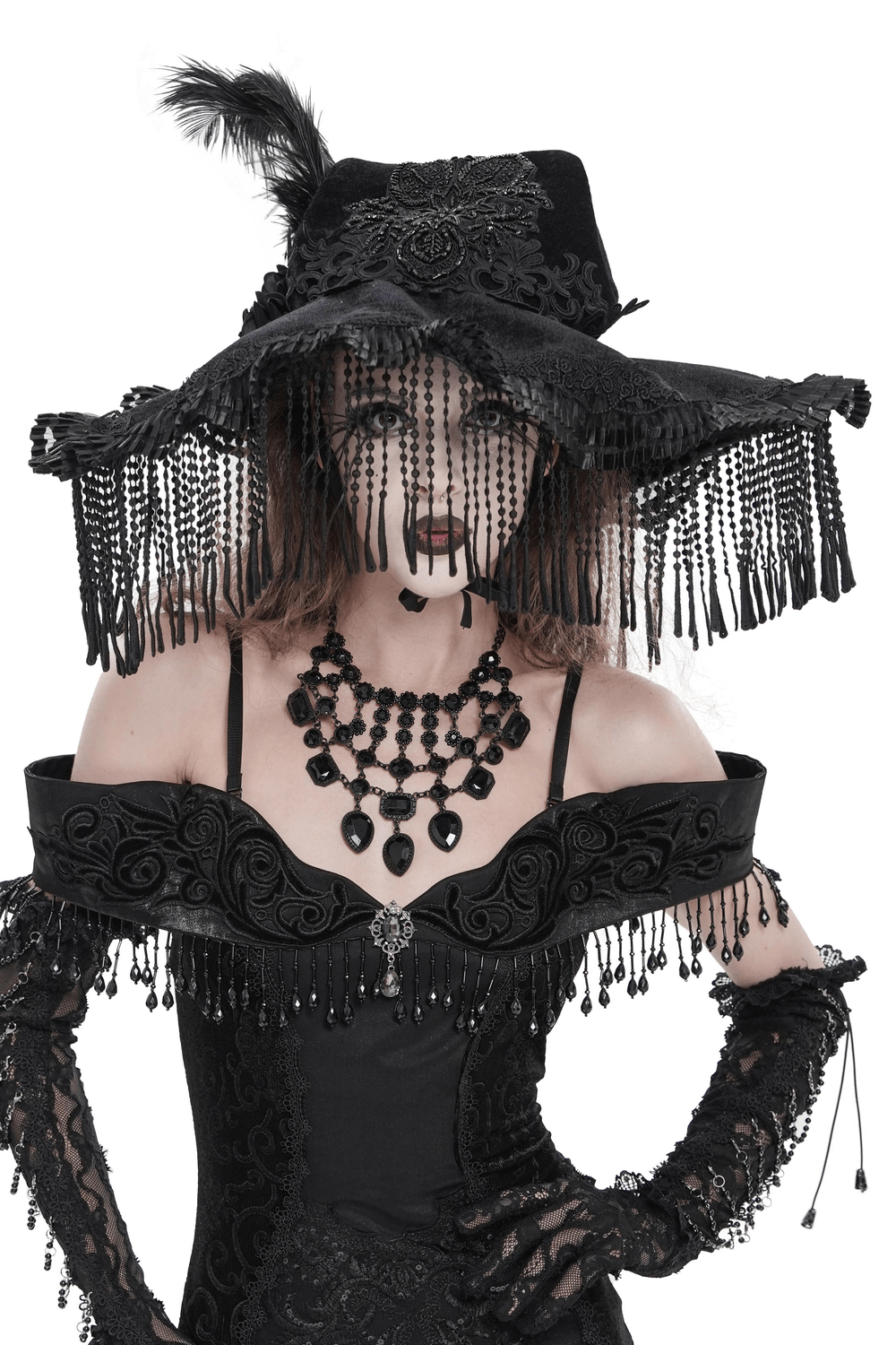Black Witch Hat with Lace Fringe and Feather Detail worn by a model in gothic attire, showcasing intricate lace and feather accents.