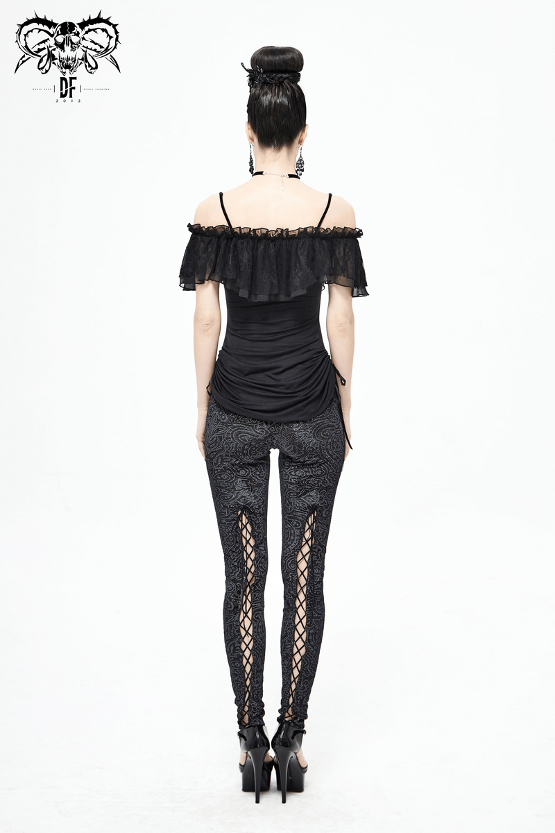 Black women's gothic off-shoulder mini dress with lace inserts, paired with stylish black leggings.