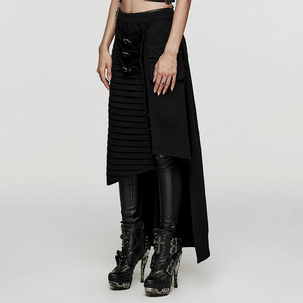 Black wrap maxi skirt with buckle accents and 3D pockets, paired with edgy platform boots.