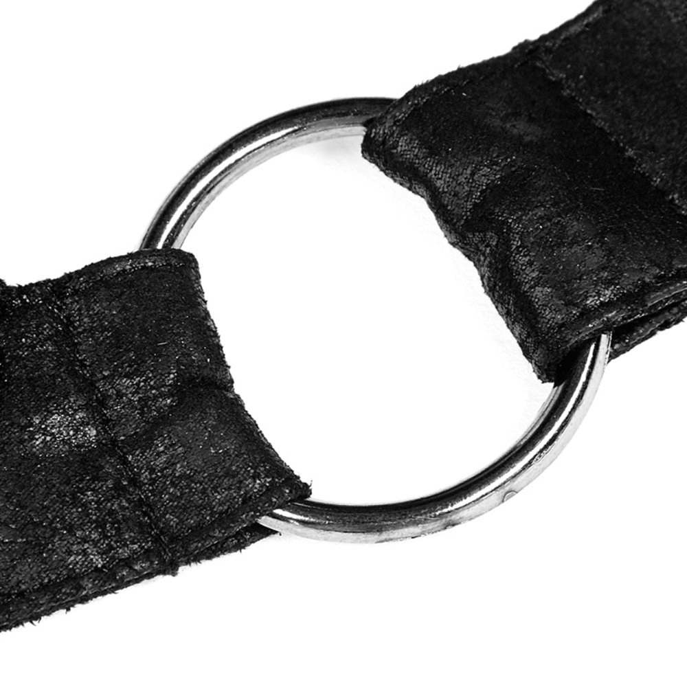 Close-up of a black halter top ring detail, showcasing edgy punk-inspired design and sleek texture.