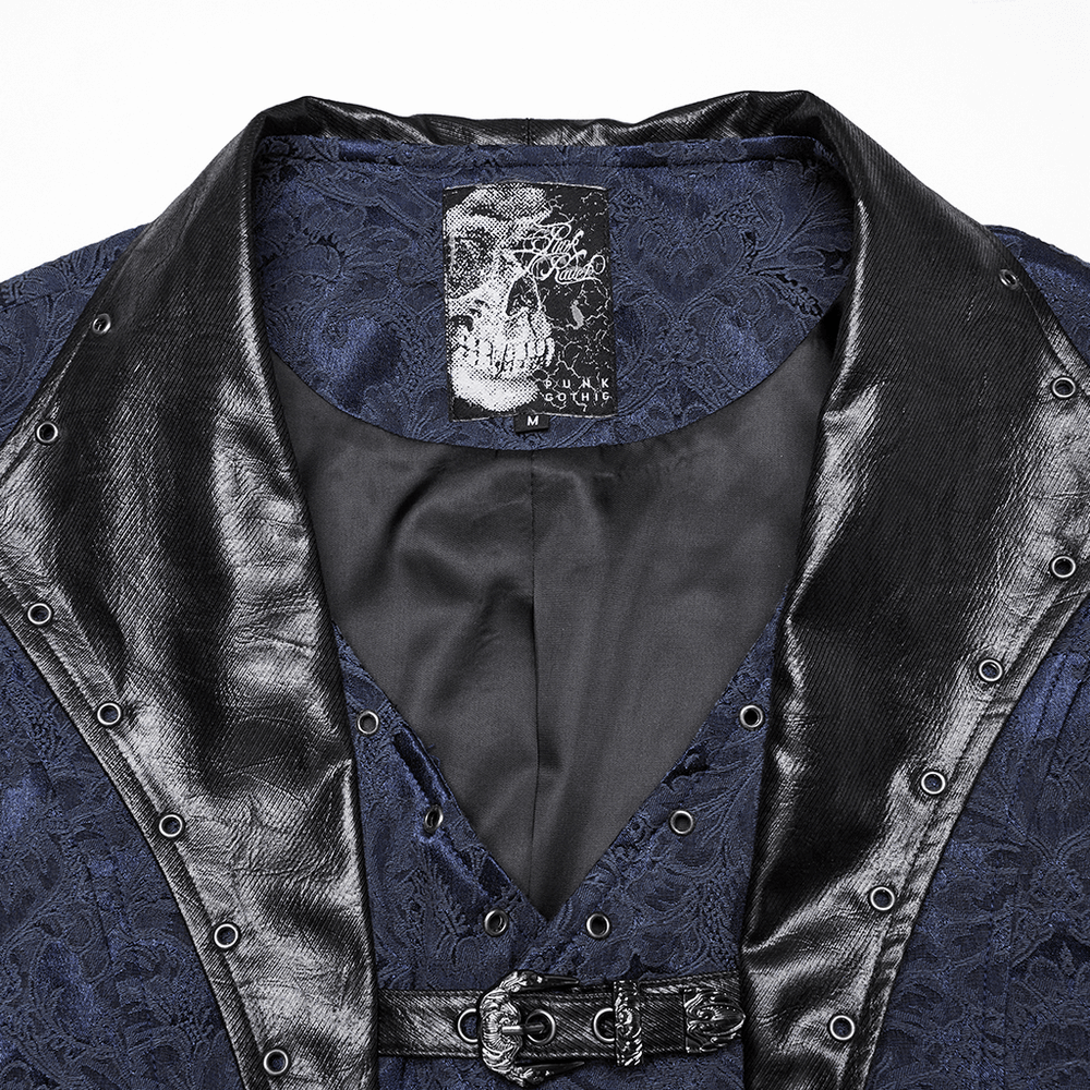 Close-up of blue gothic brocade waistcoat with leather lapel and eyelet details, showcasing skull label and elegant design.