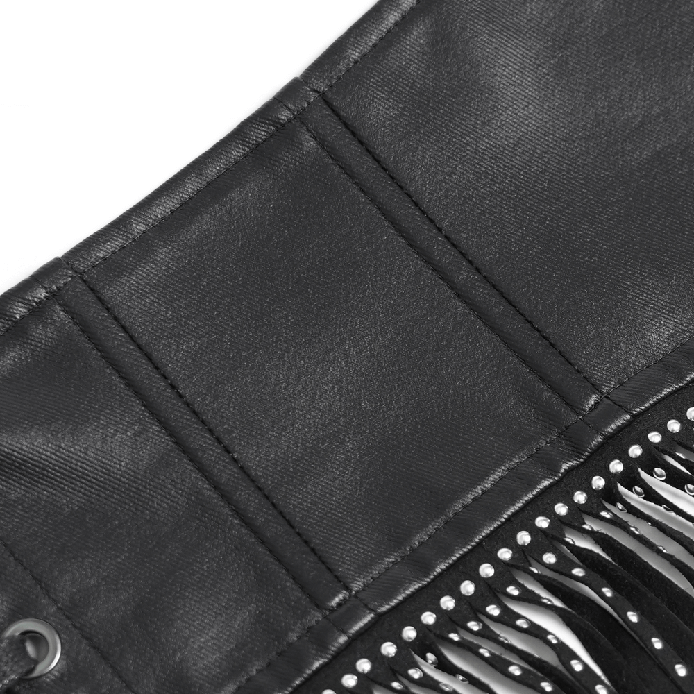 Close-up of a bold black corset belt with studded fringe tassels and front buckle details for gothic fashion.
