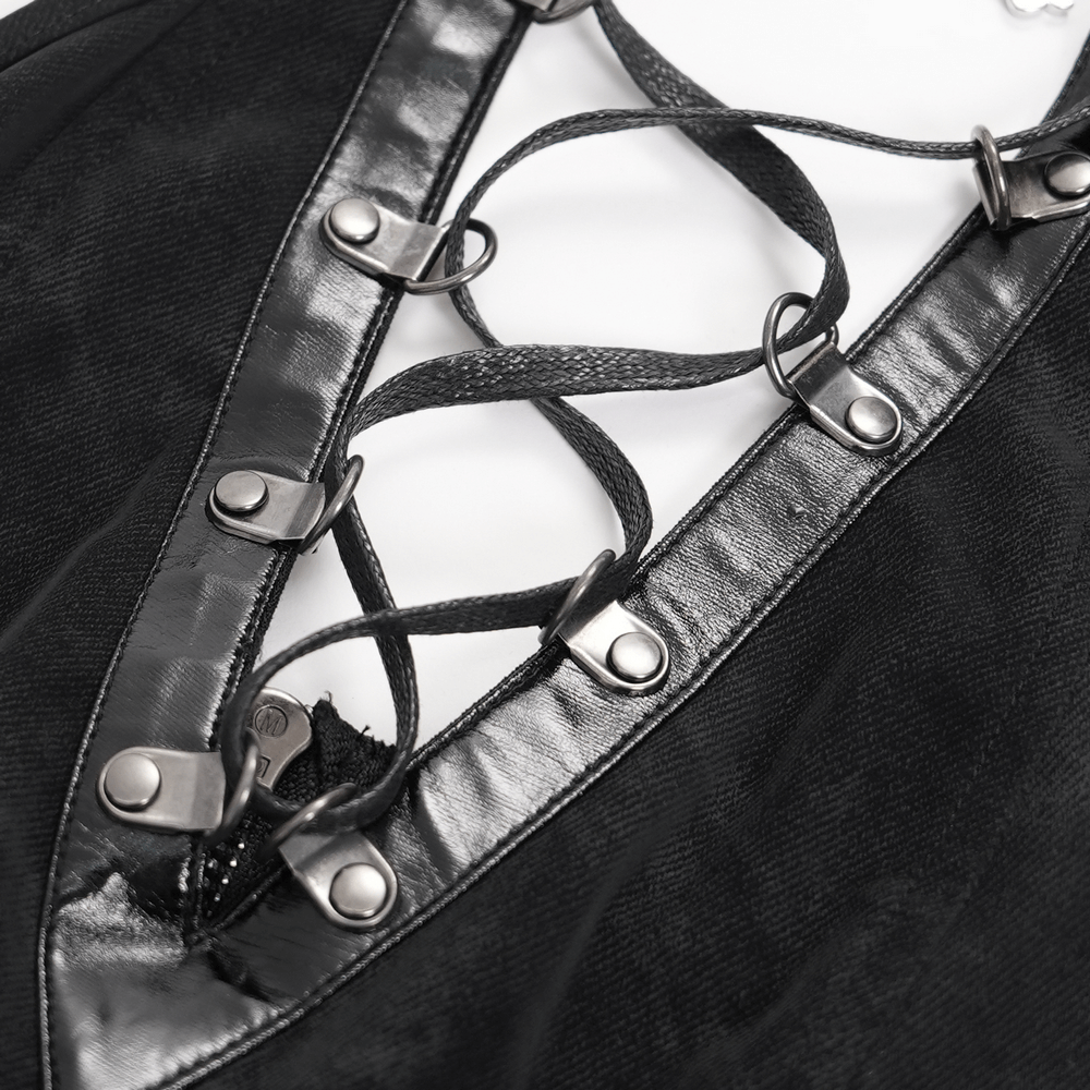 Close-up of the lace-up detail and buckles on a bold black halter dress, perfect for punk rock fashion lovers.