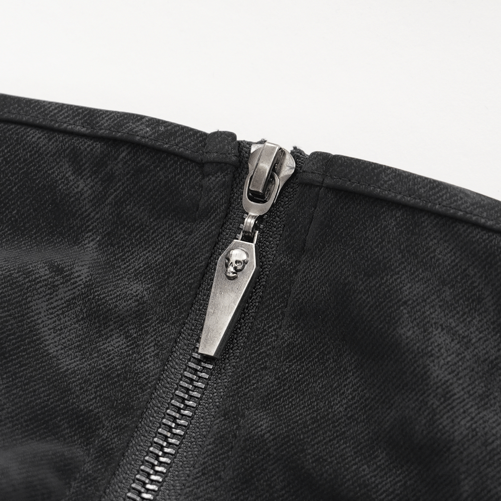 Detailed view of a black dress zipper featuring a skull design, adding a punk rock touch to alternative fashion.