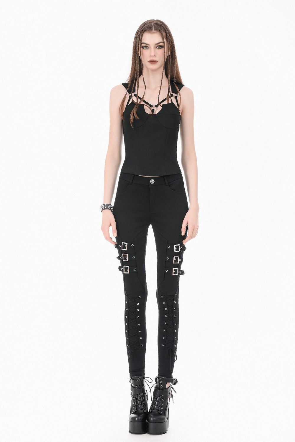 Bold Buckle Strap Lace Up Skinny Pants for Women worn with a fitted black top and edgy platform boots.