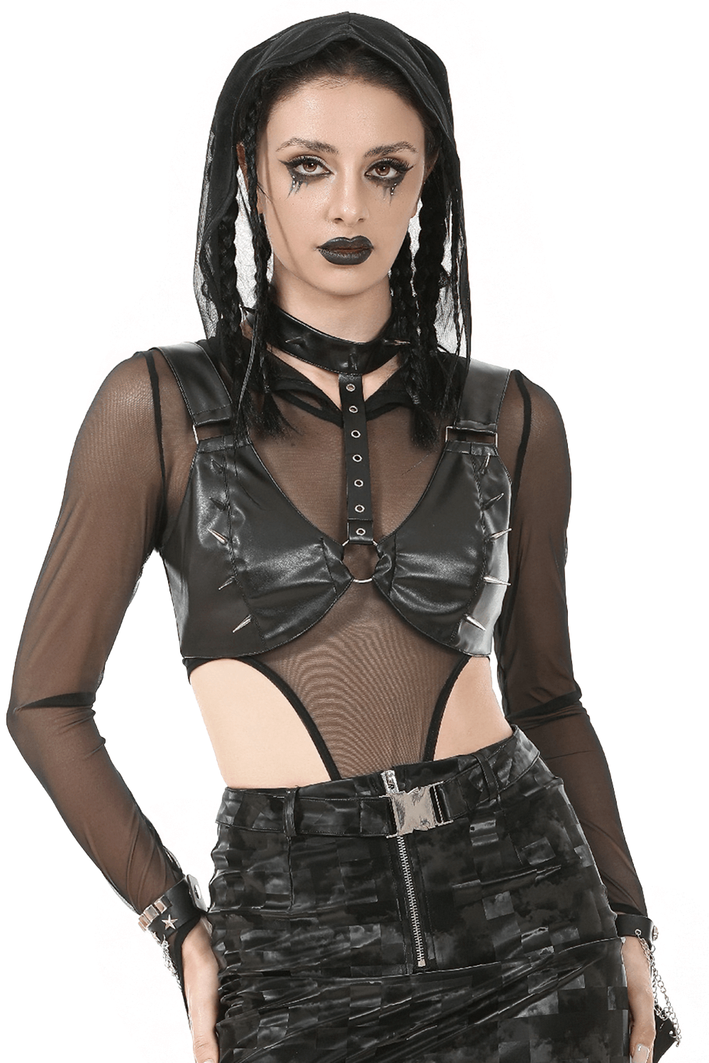Gothic punk model in faux leather spike bra top and sheer mesh sleeves, showcasing edgy alt fashion style.