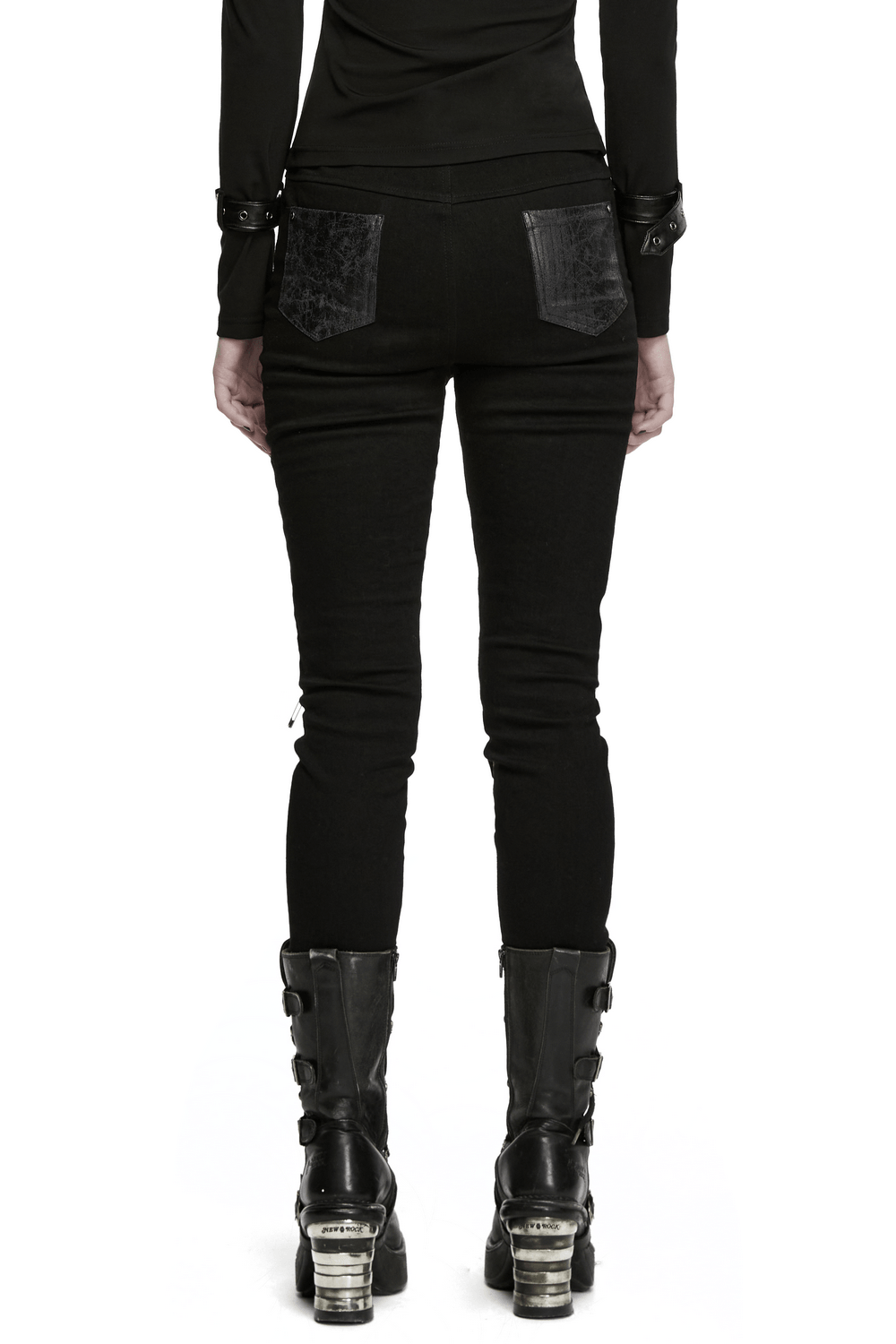 Bold Gothic Lace-Up Skinny Jeans with Buckle Details worn by a model, showcasing back view and stylish black boots.