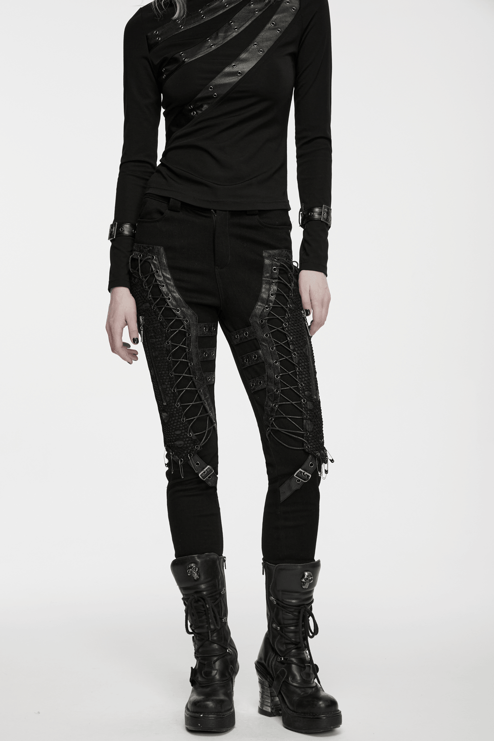 Bold Gothic Lace-Up Skinny Jeans with Buckle Details displayed with a stylish top and edgy boots.