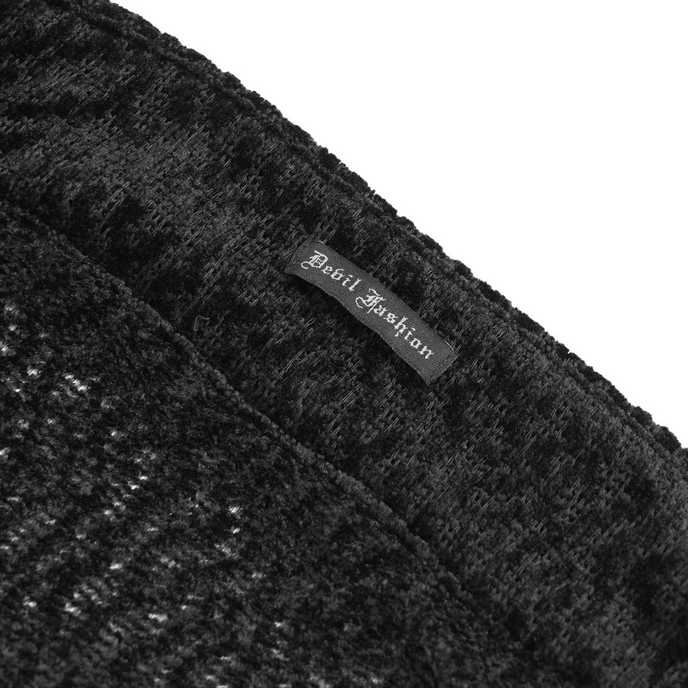 Close-up of the Bold Knit Turtleneck with Faux Leather Straps and Chains label by Devil Fashion.