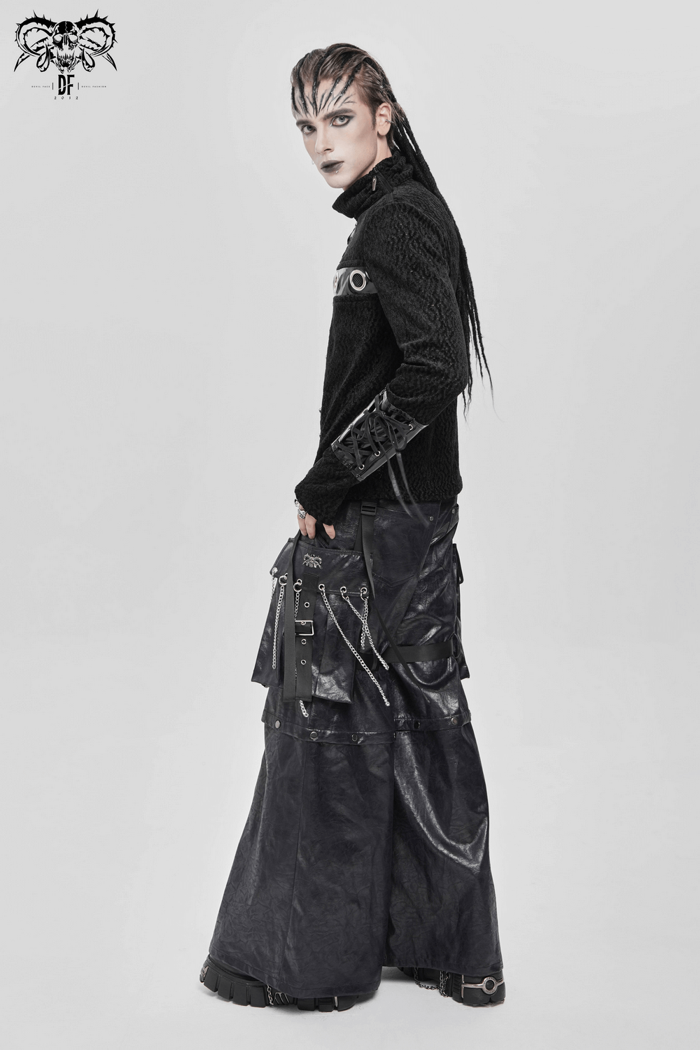 Bold Knit Turtleneck with Faux Leather Straps and Chains worn in a punk style, showcasing an edgy gothic aesthetic.